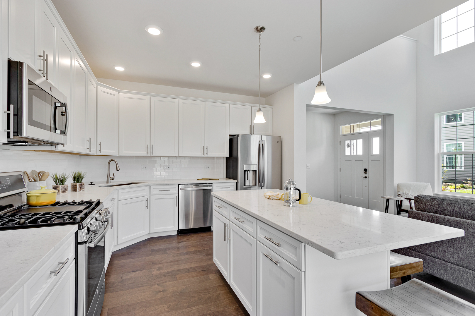 2065 Stuttle Road Batavia, IL 60510 - Photo 12 of 23 a kitchen that has a lot of cabinets in it and wooden floors