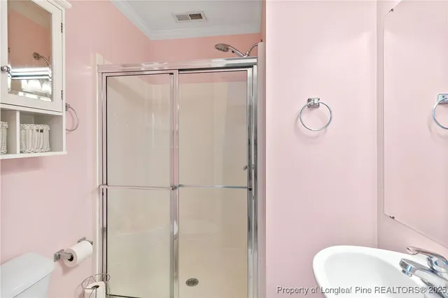 a bathroom with a granite countertop shower and a sink