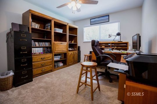 737 Peg Street Ridgecrest, CA 93555 - Photo 33 of 43 a room with furniture and cabinets