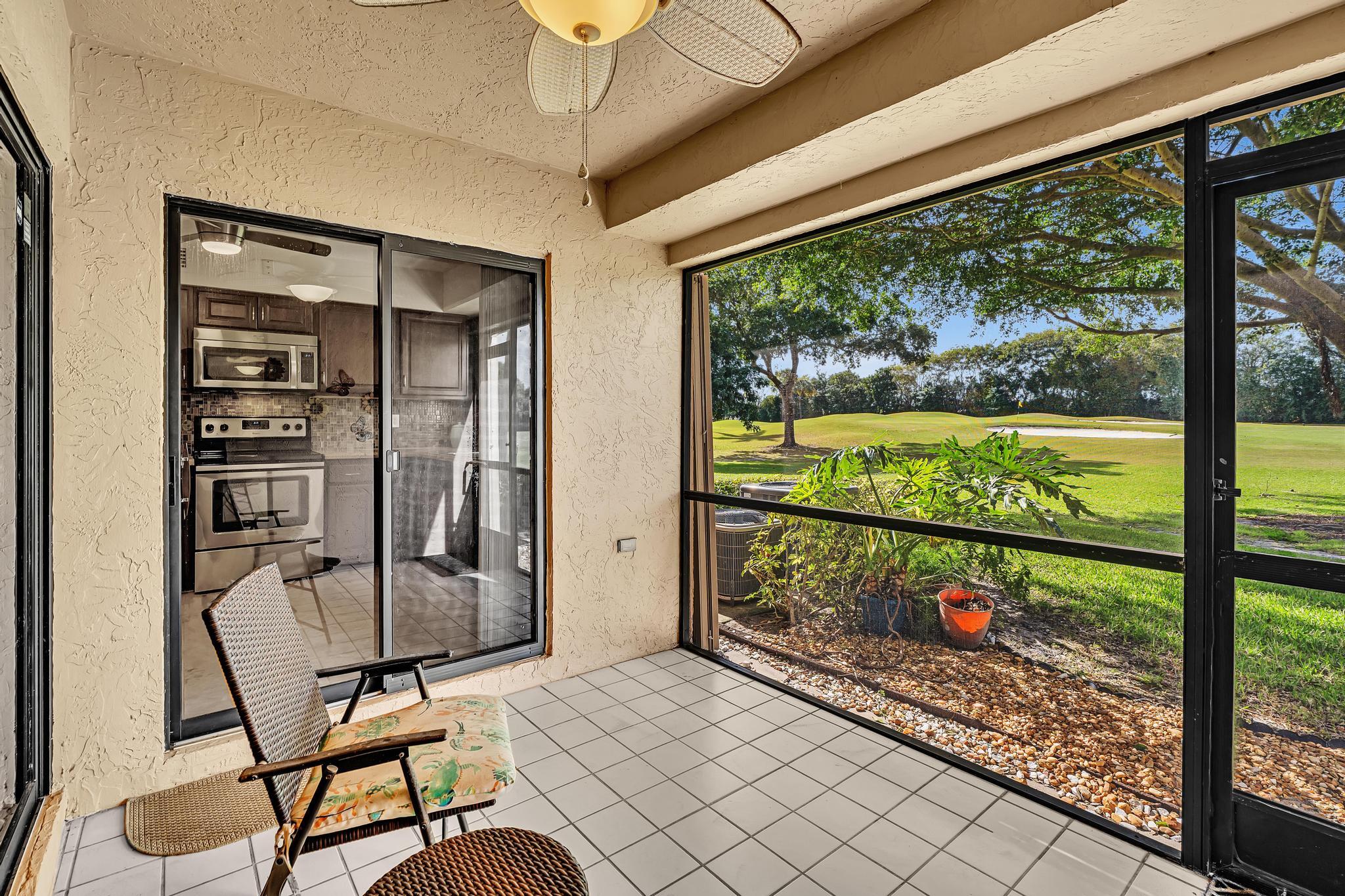 17372 Boca Club Boulevard, Unit 405 Boca Raton, FL 33487 - Photo 18 of 74 a room with furniture and a large window