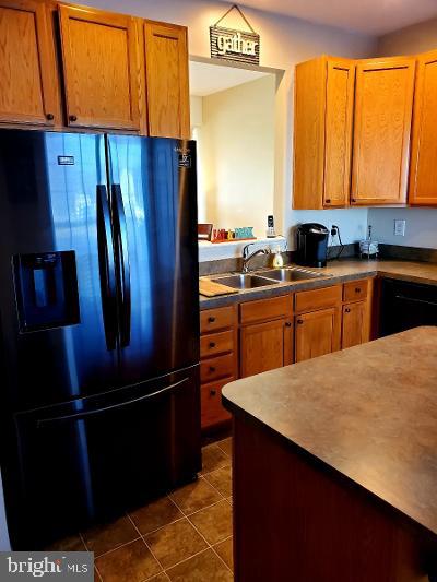 1810 Waltman Road Edgewood, MD 21040 - Photo 11 of 42 a kitchen with stainless steel appliances a refrigerator and sink