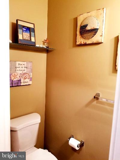 1810 Waltman Road Edgewood, MD 21040 - Photo 16 of 42 a bathroom with a toilet and a mirror