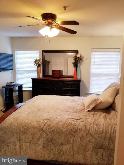 1810 Waltman Road Edgewood, MD 21040 - Photo 21 of 42 a bedroom with a bed and wooden floor