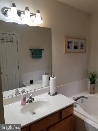 1810 Waltman Road Edgewood, MD 21040 - Photo 22 of 42 a bathroom with a sink and a mirror