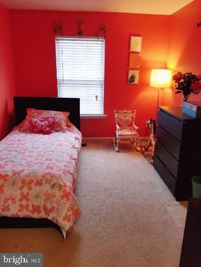 1810 Waltman Road Edgewood, MD 21040 - Photo 25 of 42 a bedroom with a bed and a lamp with the dresser