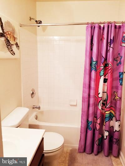1810 Waltman Road Edgewood, MD 21040 - Photo 29 of 42 a bathroom with a sink a toilet and shower curtain