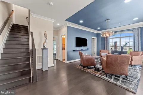 a living room with furniture flat screen tv and a fireplace