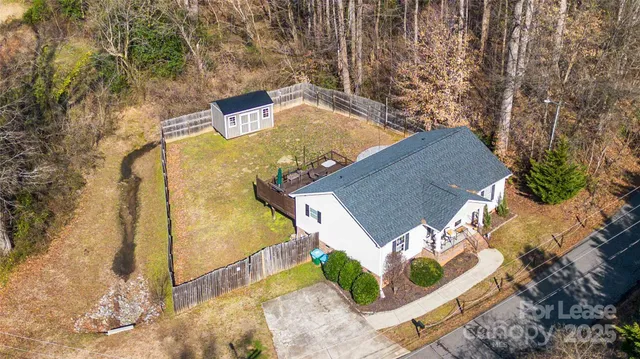 a view of swimming pool with a yard
