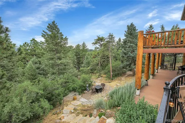 a view of a backyard with sitting area