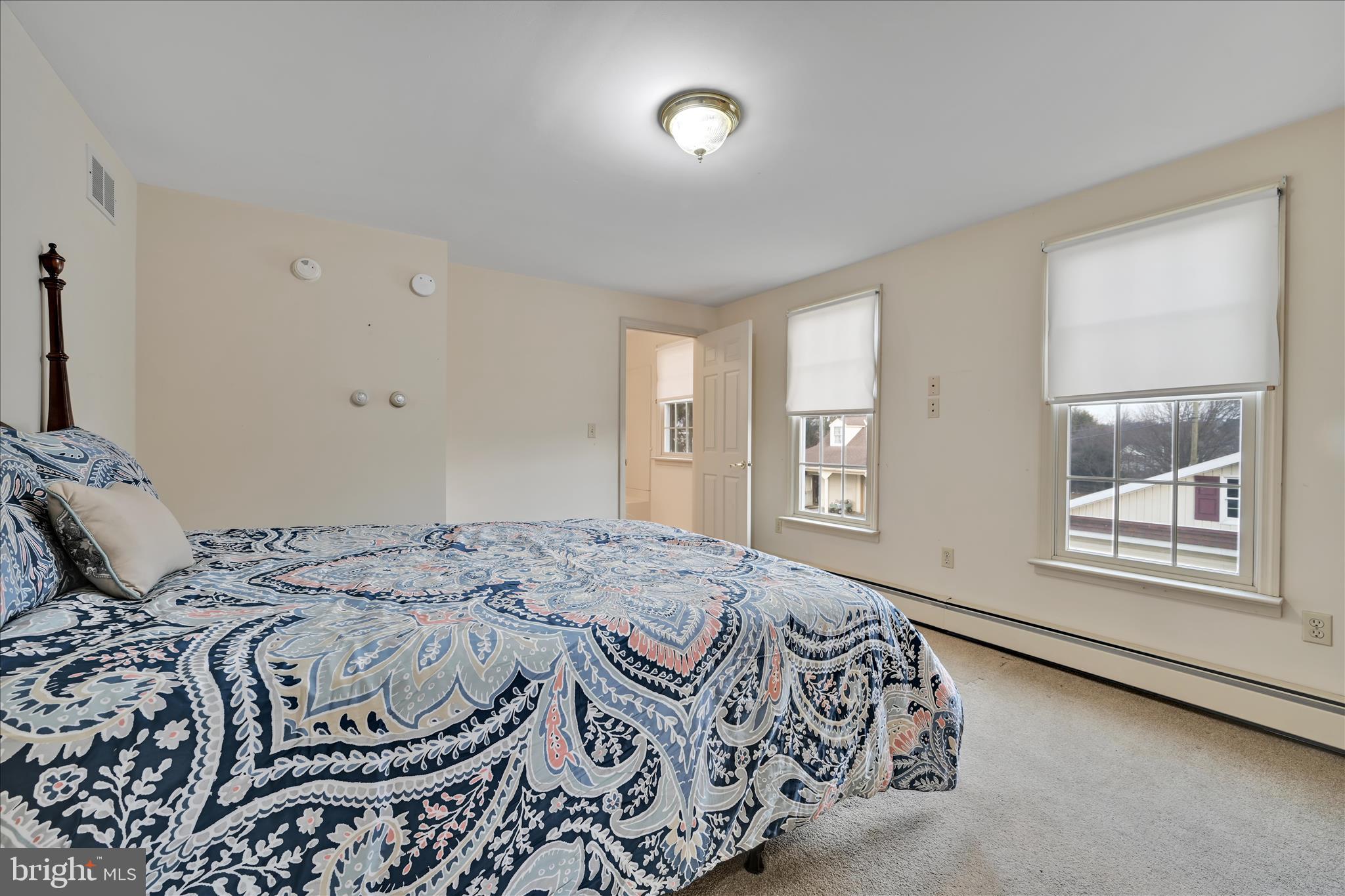 100 North Guthriesville Road Downingtown, PA 19335 - Photo 18 of 44 a bedroom with a bed and a window