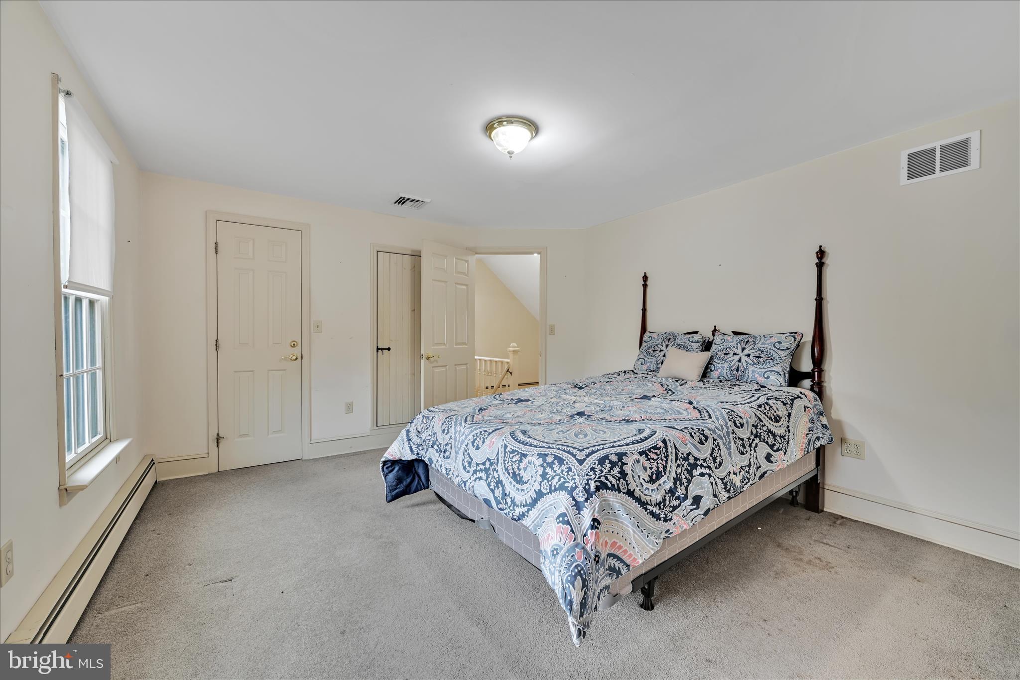 100 North Guthriesville Road Downingtown, PA 19335 - Photo 19 of 44 a spacious bedroom with a bed and a window