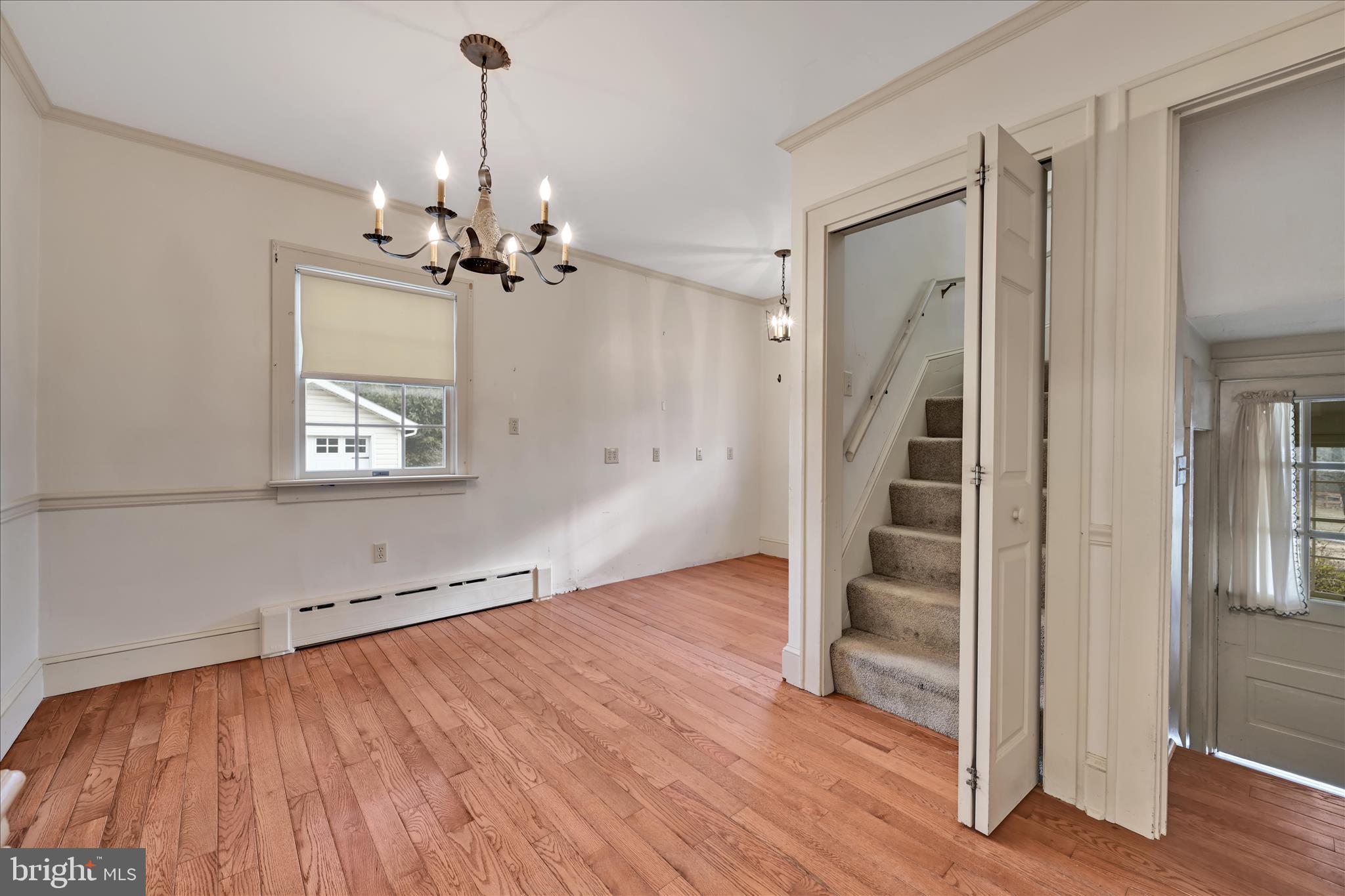 100 North Guthriesville Road Downingtown, PA 19335 - Photo 25 of 44 wooden floor in an empty room with a window