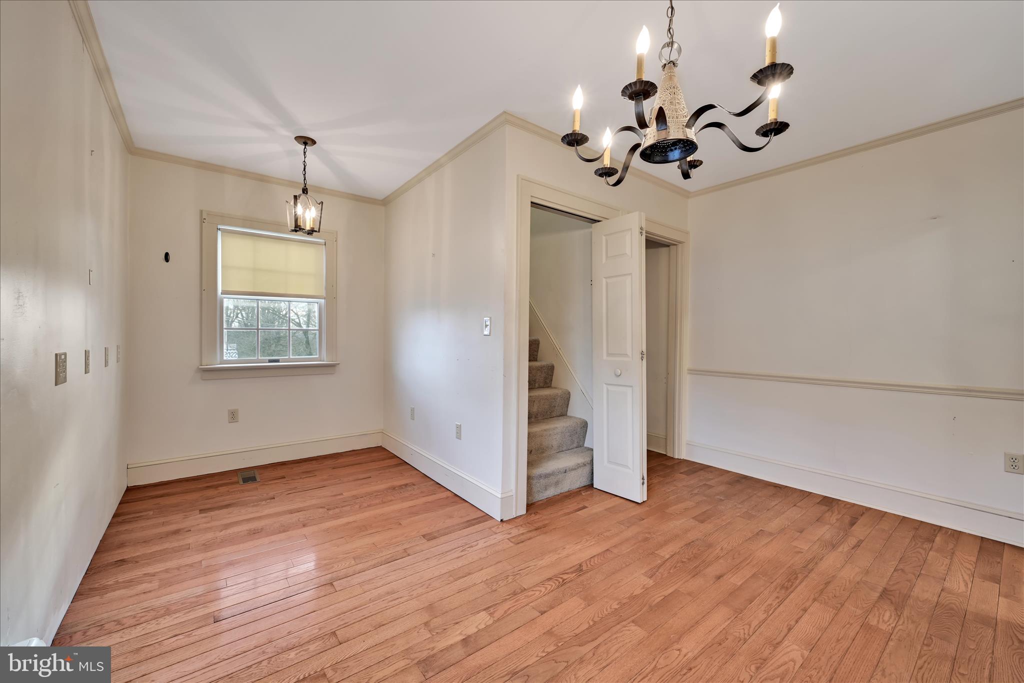 100 North Guthriesville Road Downingtown, PA 19335 - Photo 26 of 44 a view of a room with wooden floor chandelier and window