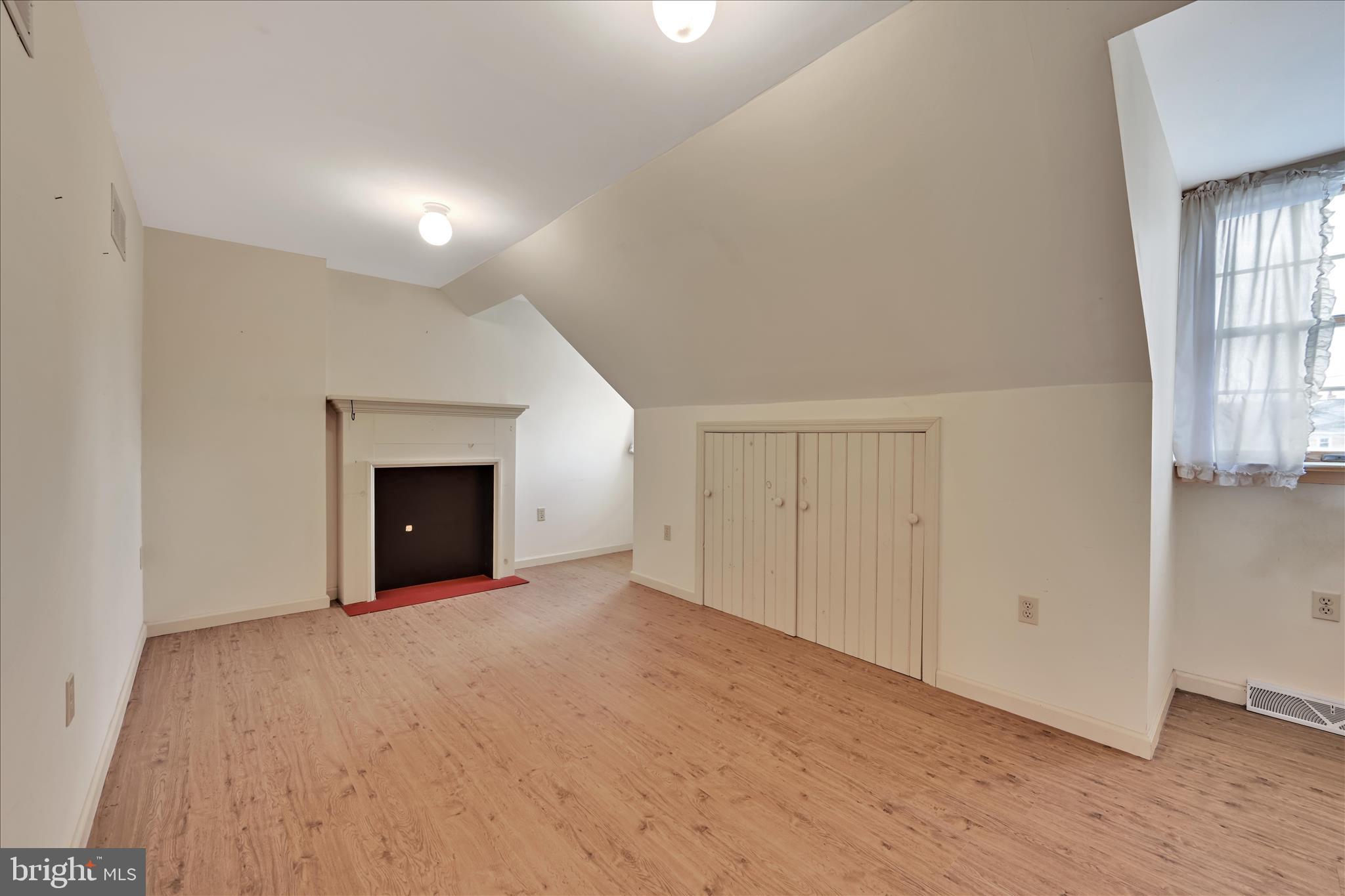 100 North Guthriesville Road Downingtown, PA 19335 - Photo 27 of 44 an empty room with windows and fireplace