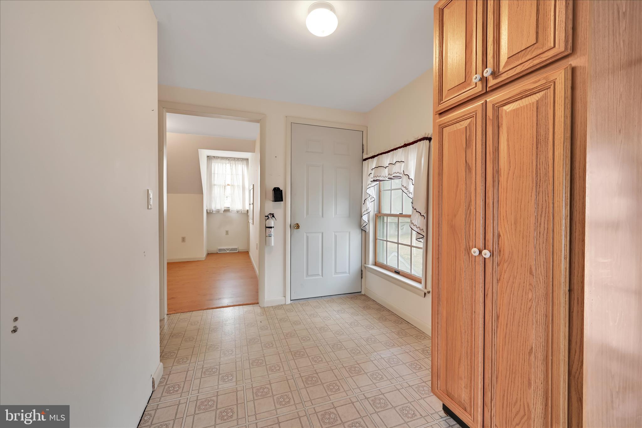 100 North Guthriesville Road Downingtown, PA 19335 - Photo 30 of 44 a view of a hallway with wooden shelves