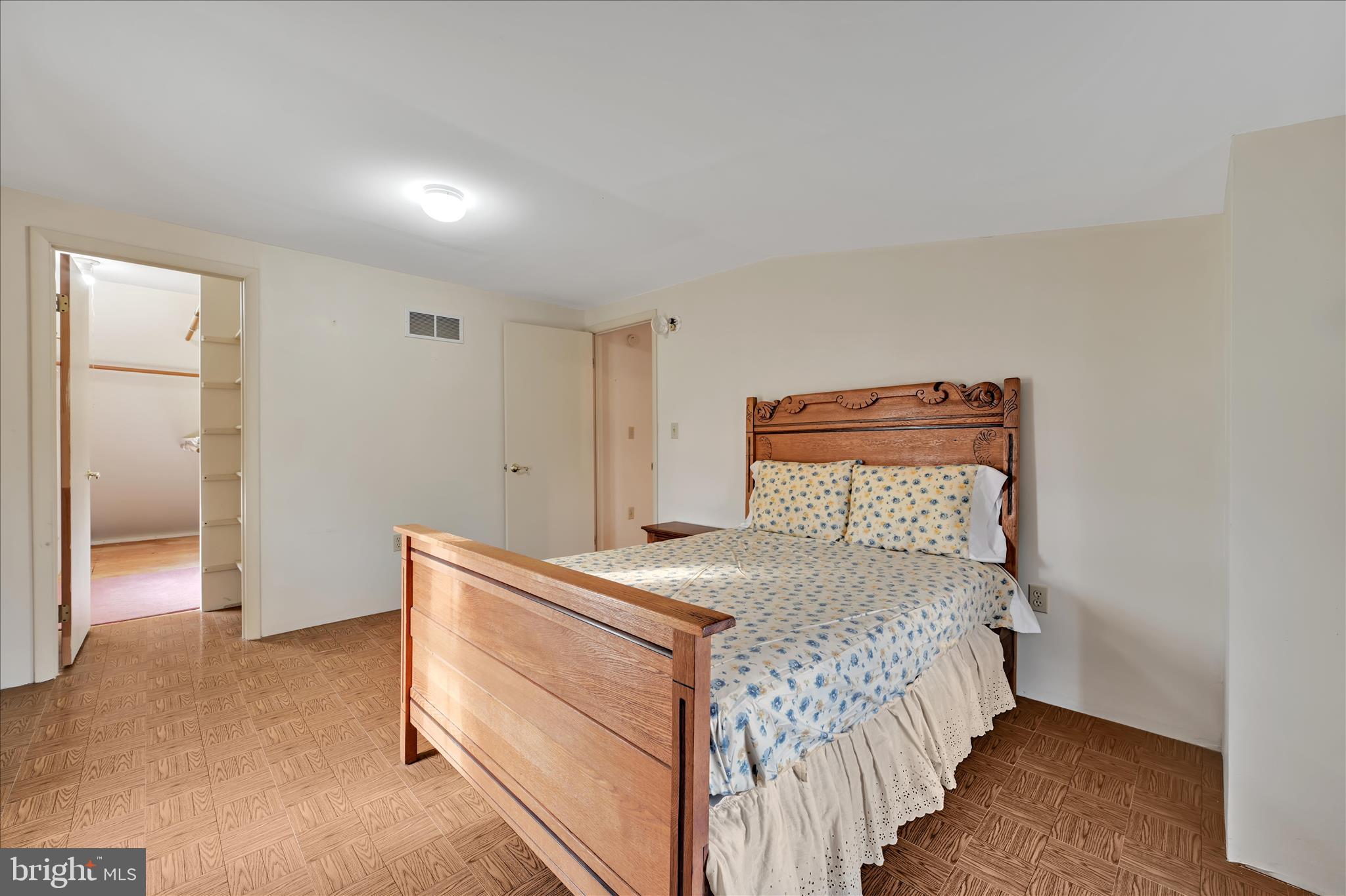 100 North Guthriesville Road Downingtown, PA 19335 - Photo 32 of 44 a bedroom with a bed and a lamp