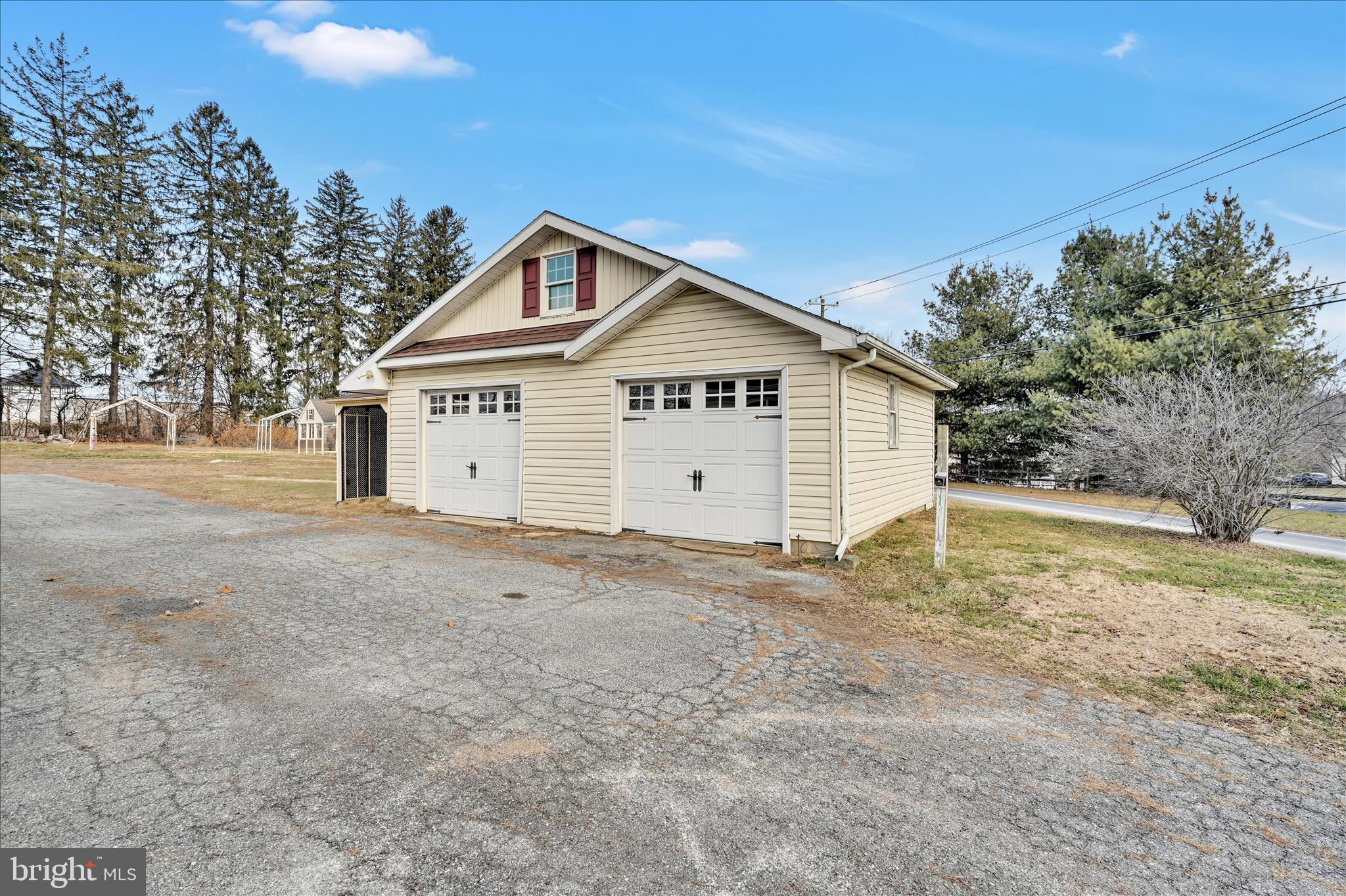 100 North Guthriesville Road Downingtown, PA 19335 - Photo 35 of 44 a view of a house with a backyard and trees