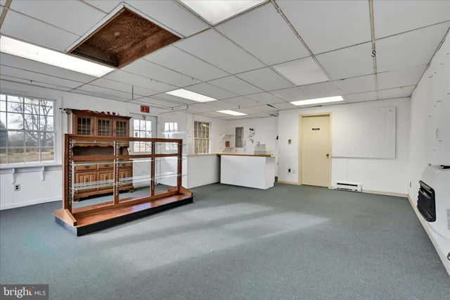 a room with furniture and white walls