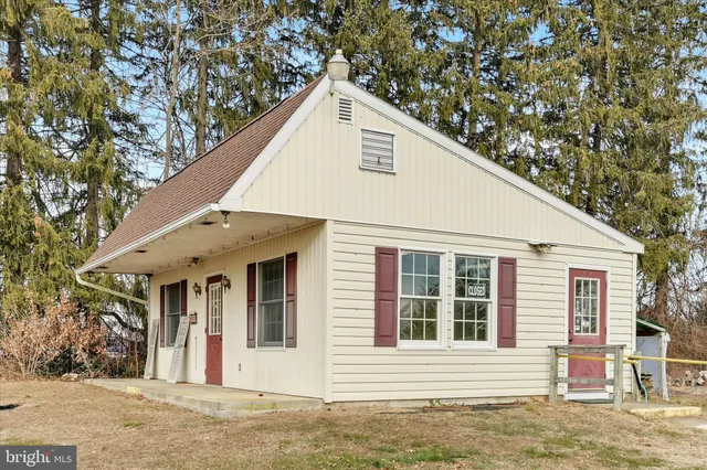 a view of a white house with a large windows