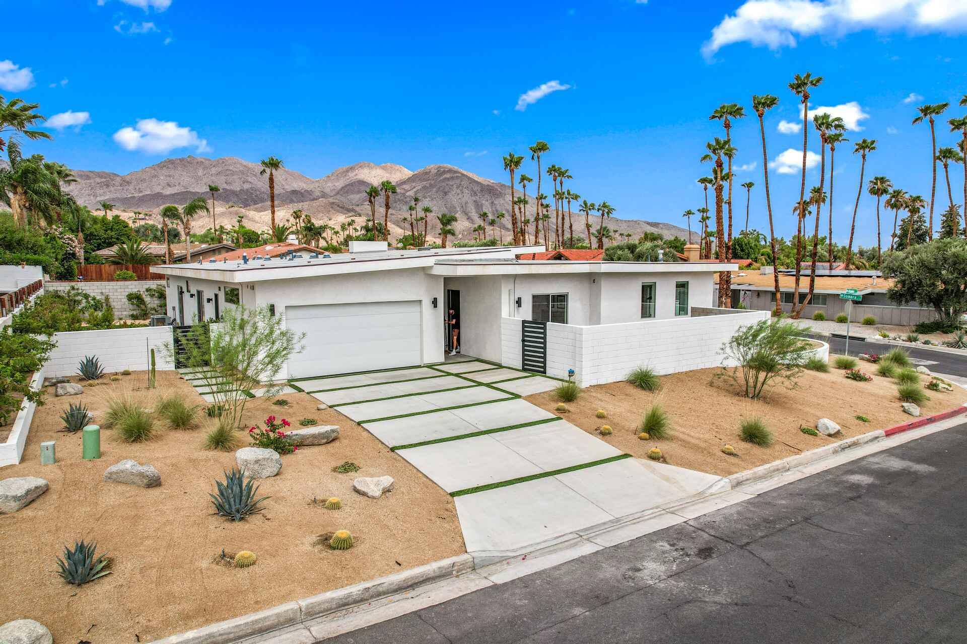 72985 Somera Road Palm Desert, CA 92260 - Photo 3 of 17 a view of a terrace with a swimming pool