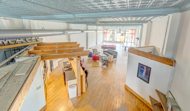 a room with wooden floor and furniture