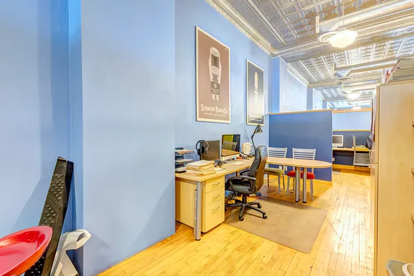 a view of a workspace with furniture