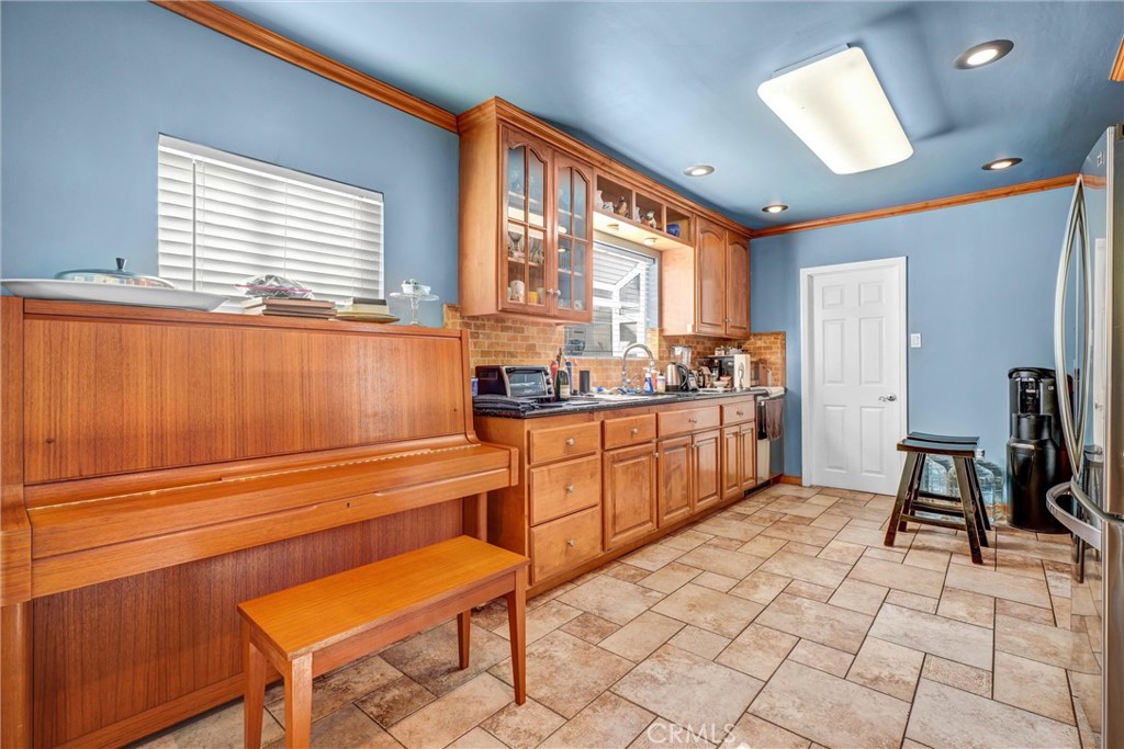 4816 Stratford Road Los Angeles, CA 90042 - Photo 13 of 20 a kitchen with a sink cabinets and window