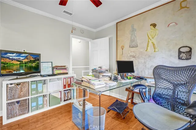 a room with a table chairs and a flat screen tv
