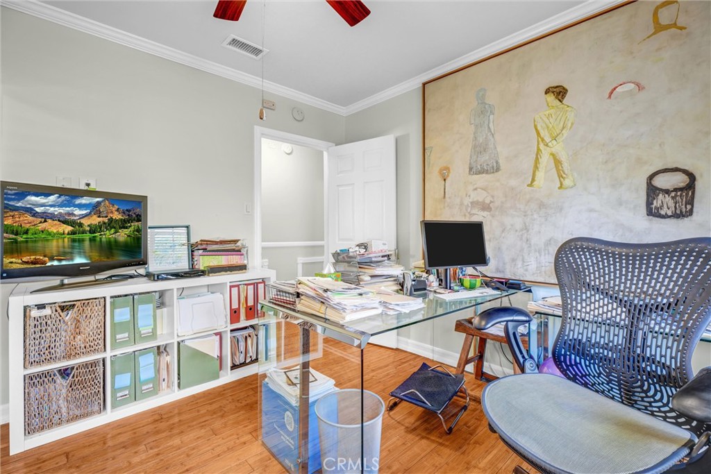 4816 Stratford Road Los Angeles, CA 90042 - Photo 7 of 20 a room with a table chairs and a flat screen tv