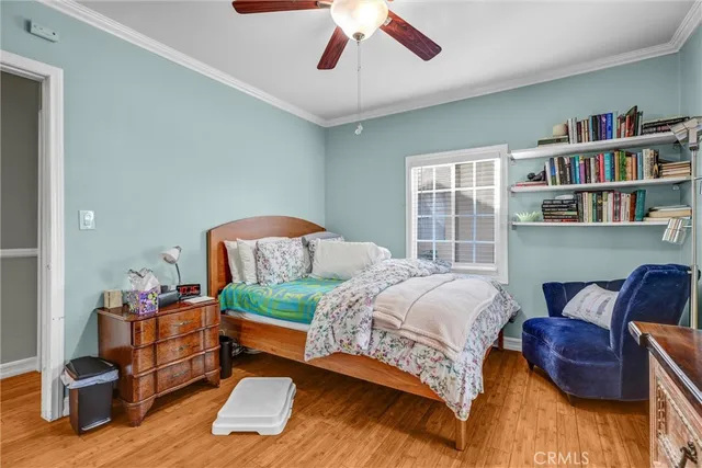 a bedroom with a bed and a book shelf