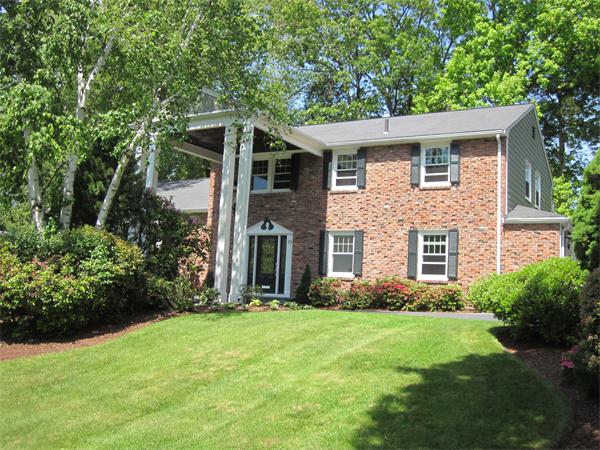 40 Grace Road Newton, MA 02459 - Photo 1 of 24 a front view of house with yard and green space