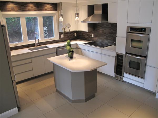40 Grace Road Newton, MA 02459 - Photo 11 of 24 a kitchen with stainless steel appliances granite countertop a stove a sink and a microwave