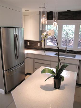40 Grace Road Newton, MA 02459 - Photo 12 of 24 a kitchen with a refrigerator and a sink