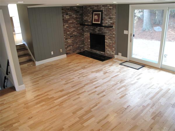40 Grace Road Newton, MA 02459 - Photo 15 of 24 a view of empty room with wooden floor and fireplace