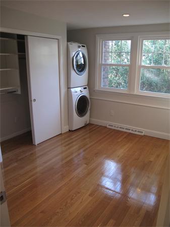 40 Grace Road Newton, MA 02459 - Photo 16 of 24 a view of an empty room with wooden floor and a window