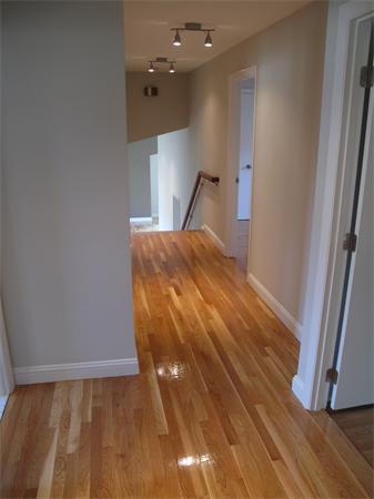 40 Grace Road Newton, MA 02459 - Photo 17 of 24 a view of a hallway with wooden floor