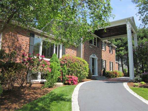 40 Grace Road Newton, MA 02459 - Photo 2 of 24 a front view of a house with garden