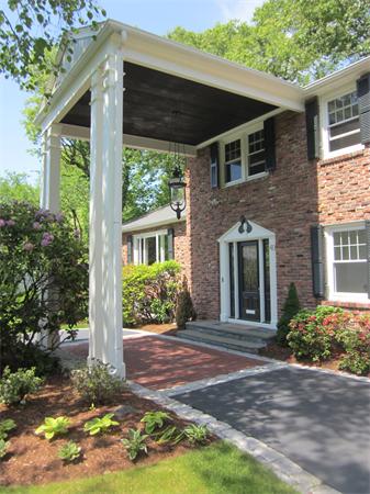 40 Grace Road Newton, MA 02459 - Photo 3 of 24 a front view of a house with garden