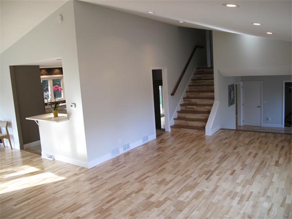 40 Grace Road Newton, MA 02459 - Photo 9 of 24 a view of a hallway with wooden floor and staircase