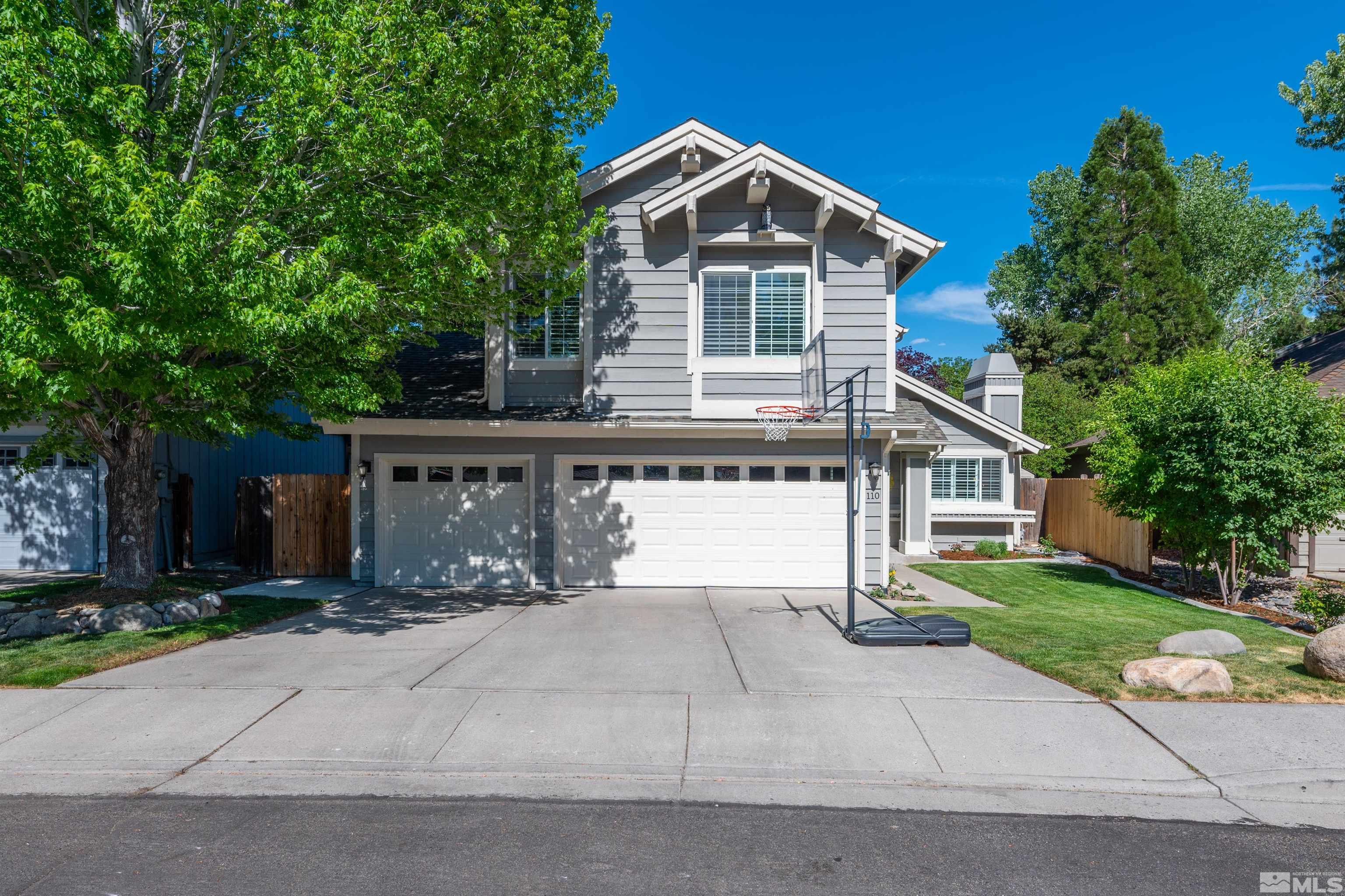 110 Riverhaven Place Reno, NV 89519 - Photo 2 of 40 a front view of a house with a yard and garage