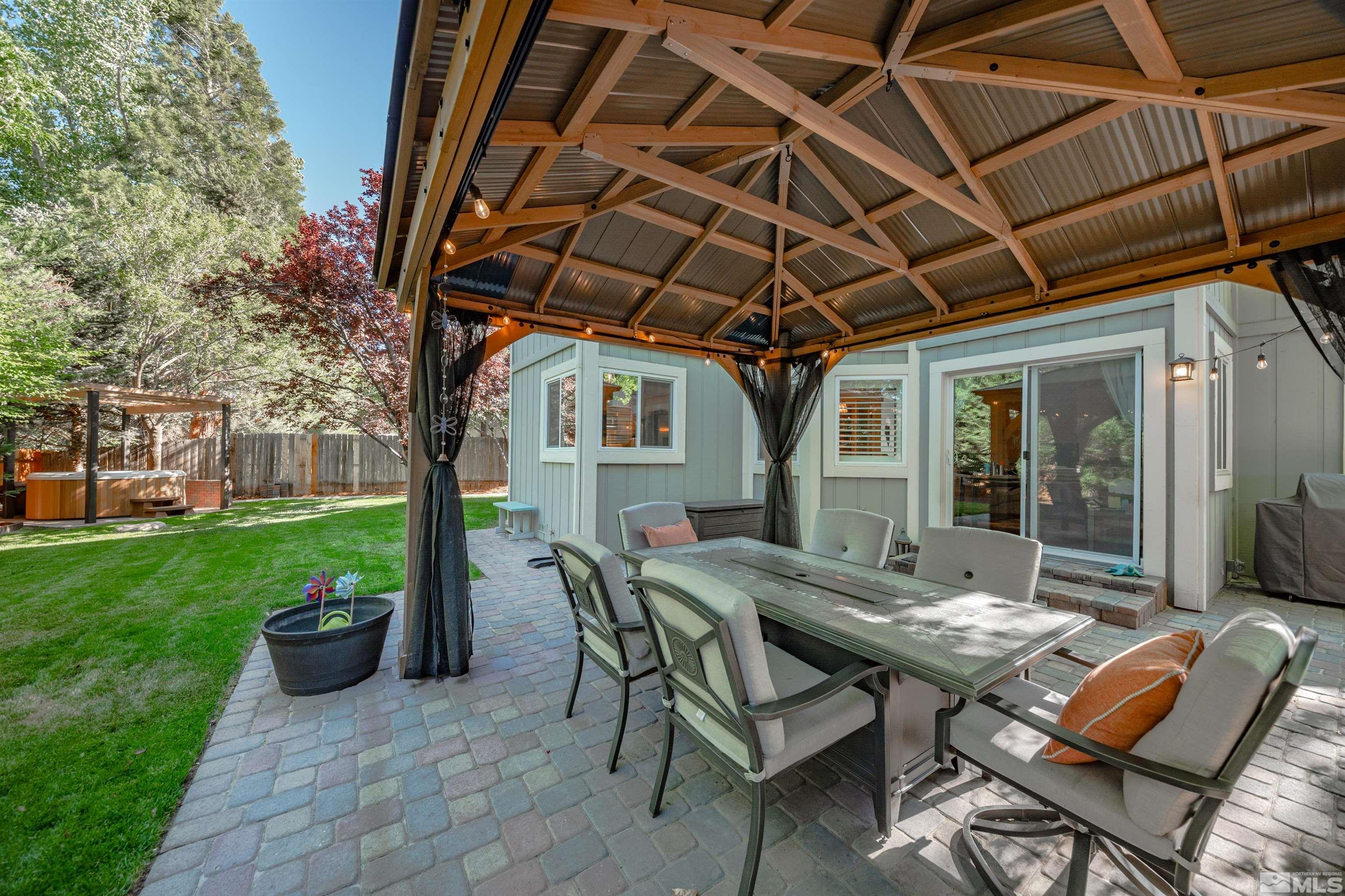 110 Riverhaven Place Reno, NV 89519 - Photo 32 of 40 a view of a patio with table and chairs and potted plants