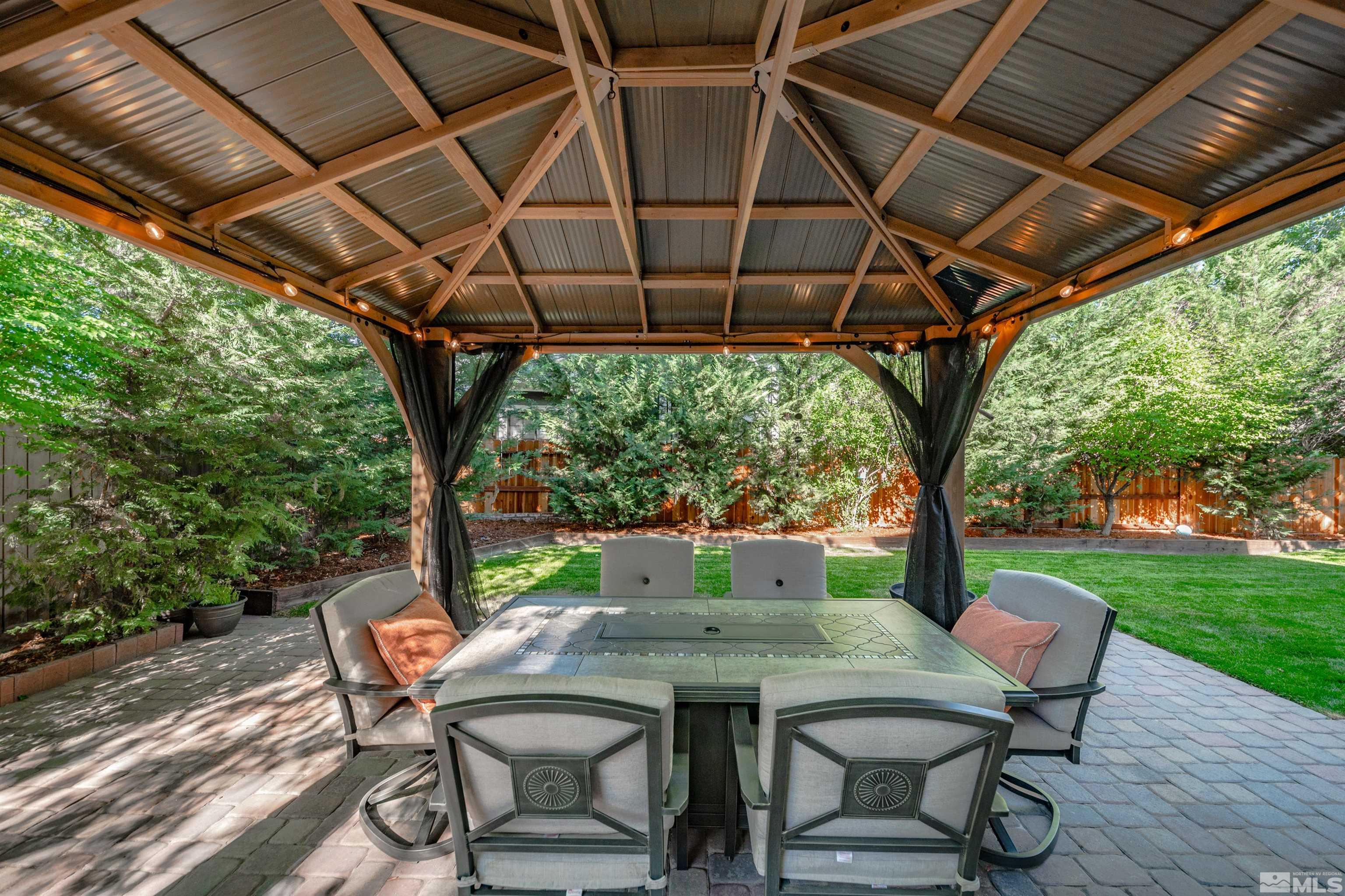 110 Riverhaven Place Reno, NV 89519 - Photo 34 of 40 a patio with an outdoor seating