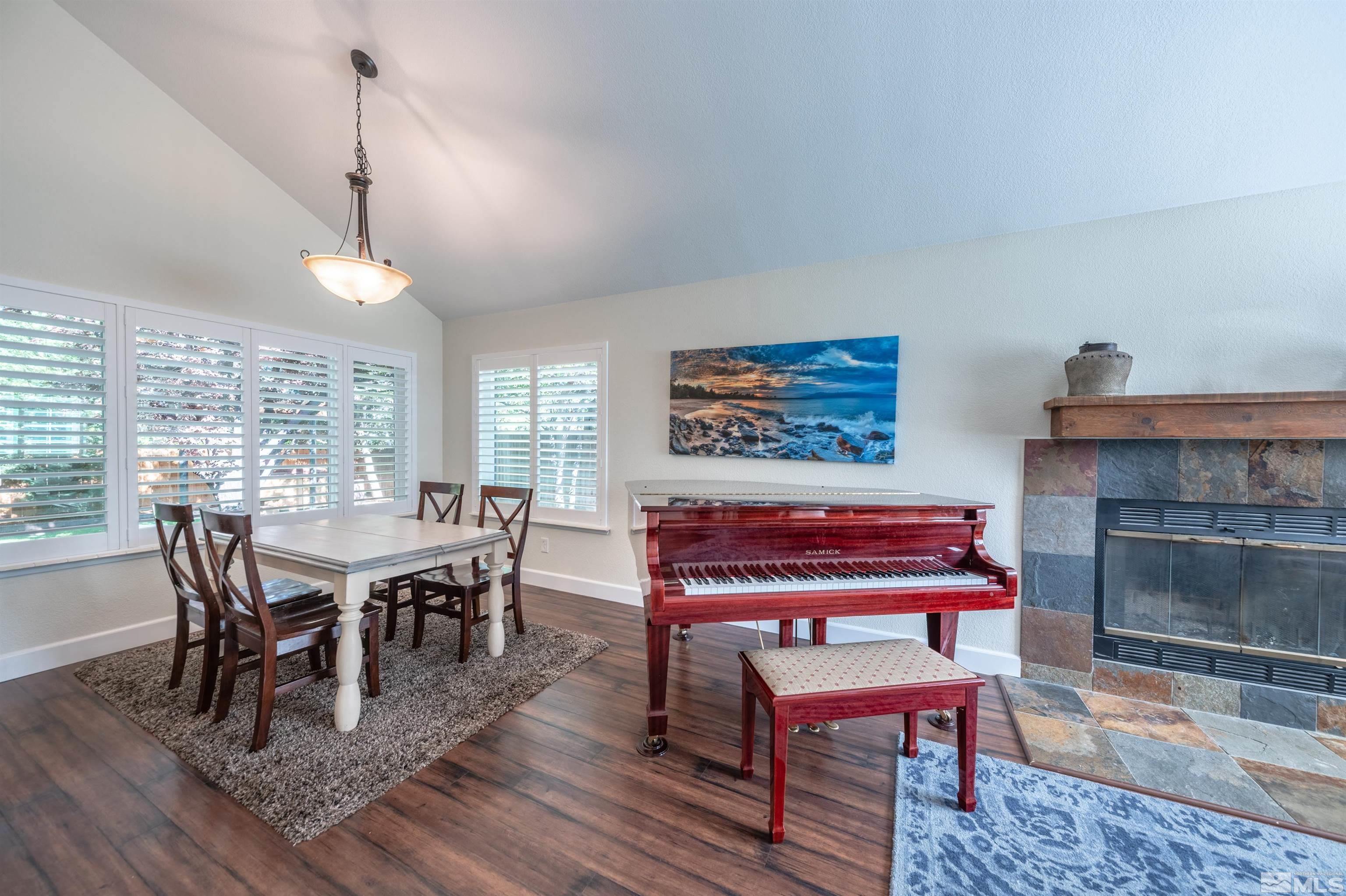 110 Riverhaven Place Reno, NV 89519 - Photo 7 of 40 a dining room with furniture a rug and a chandelier