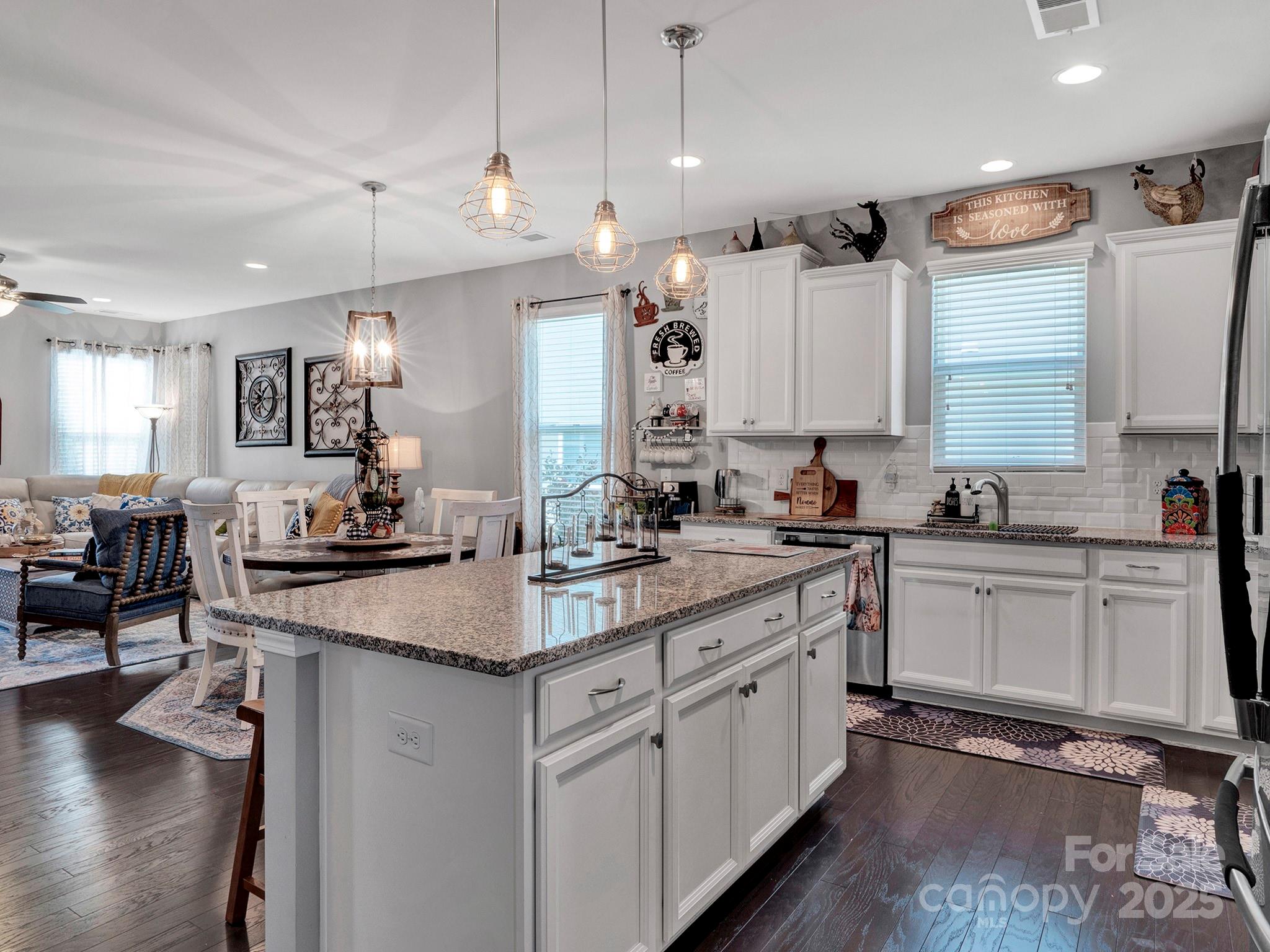 3129 Bridgewater Street, Unit 3E61 Lancaster, SC 29720 - Photo 13 of 48 a kitchen with white cabinets sink and stove
