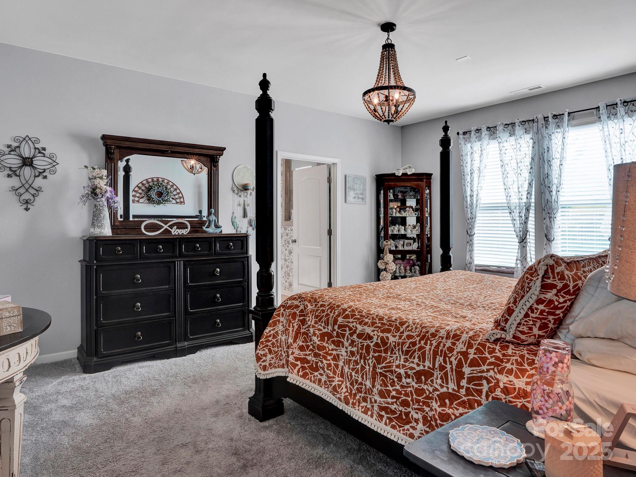 3129 Bridgewater Street, Unit 3E61 Lancaster, SC 29720 - Photo 21 of 48 a bedroom with a bed and a dresser