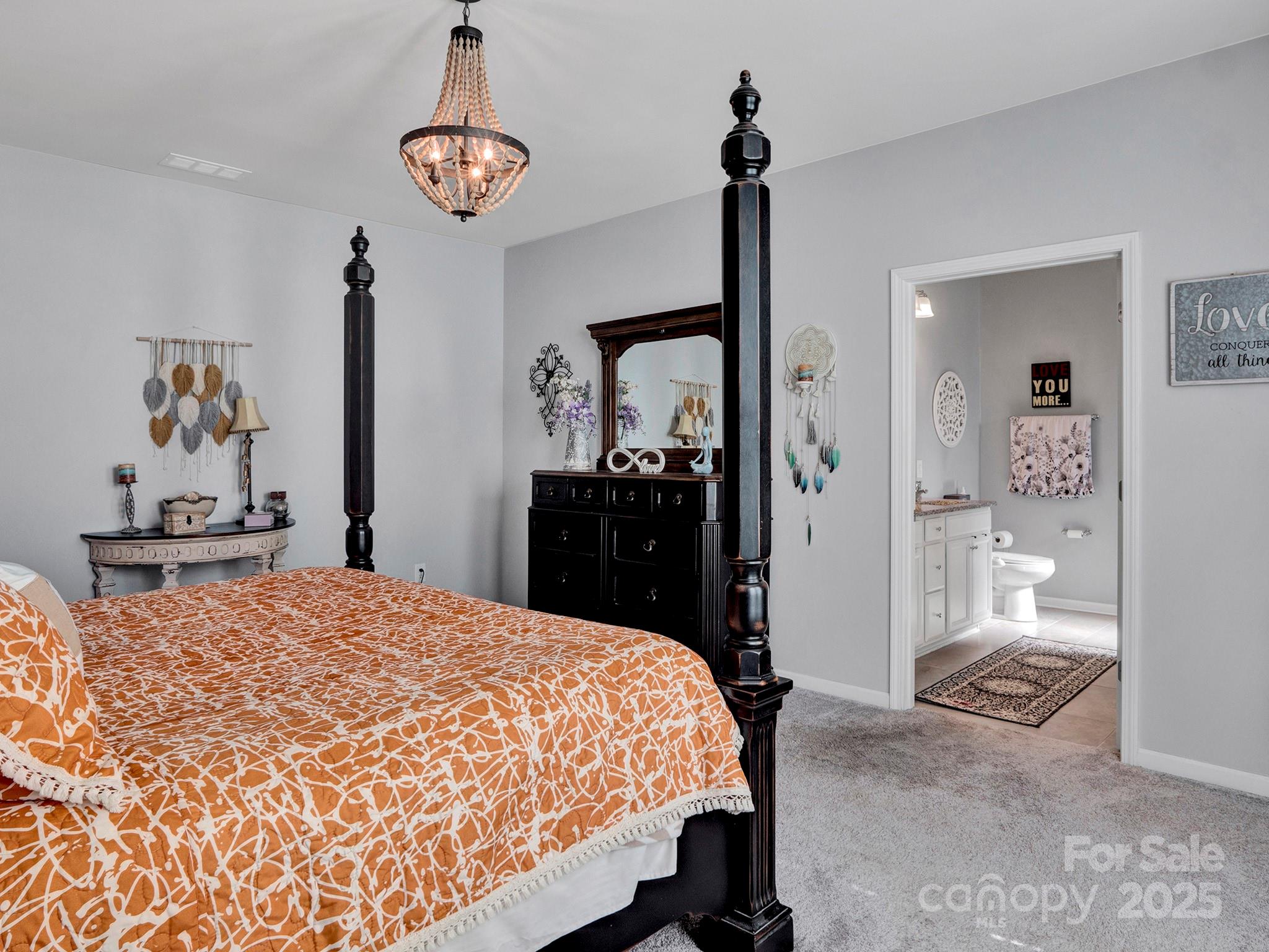 3129 Bridgewater Street, Unit 3E61 Lancaster, SC 29720 - Photo 22 of 48 a bedroom with a bed and a mirror on dresser