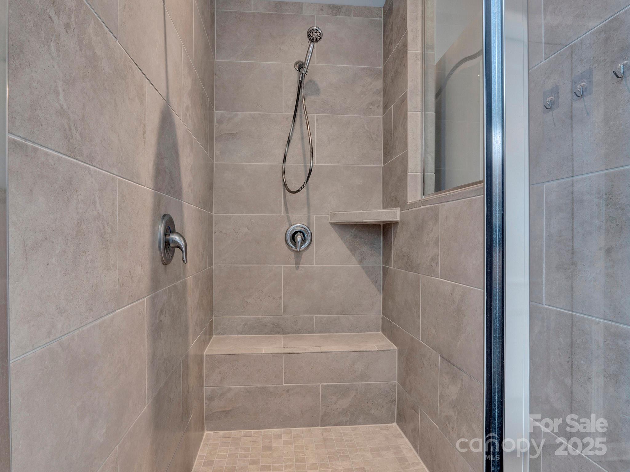3129 Bridgewater Street, Unit 3E61 Lancaster, SC 29720 - Photo 25 of 48 a bathroom with a glass shower door