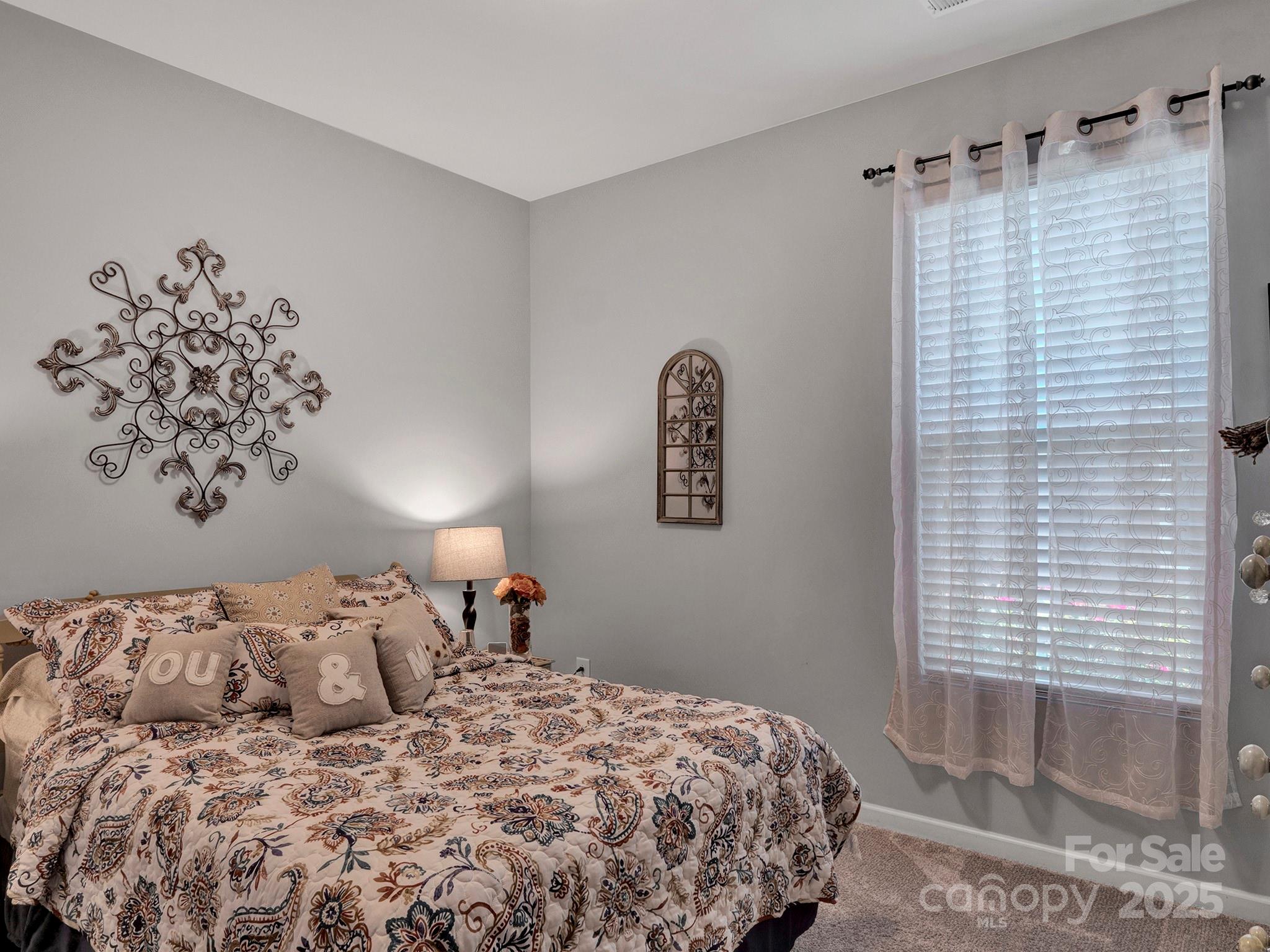 3129 Bridgewater Street, Unit 3E61 Lancaster, SC 29720 - Photo 27 of 48 a bedroom with a bed and a window