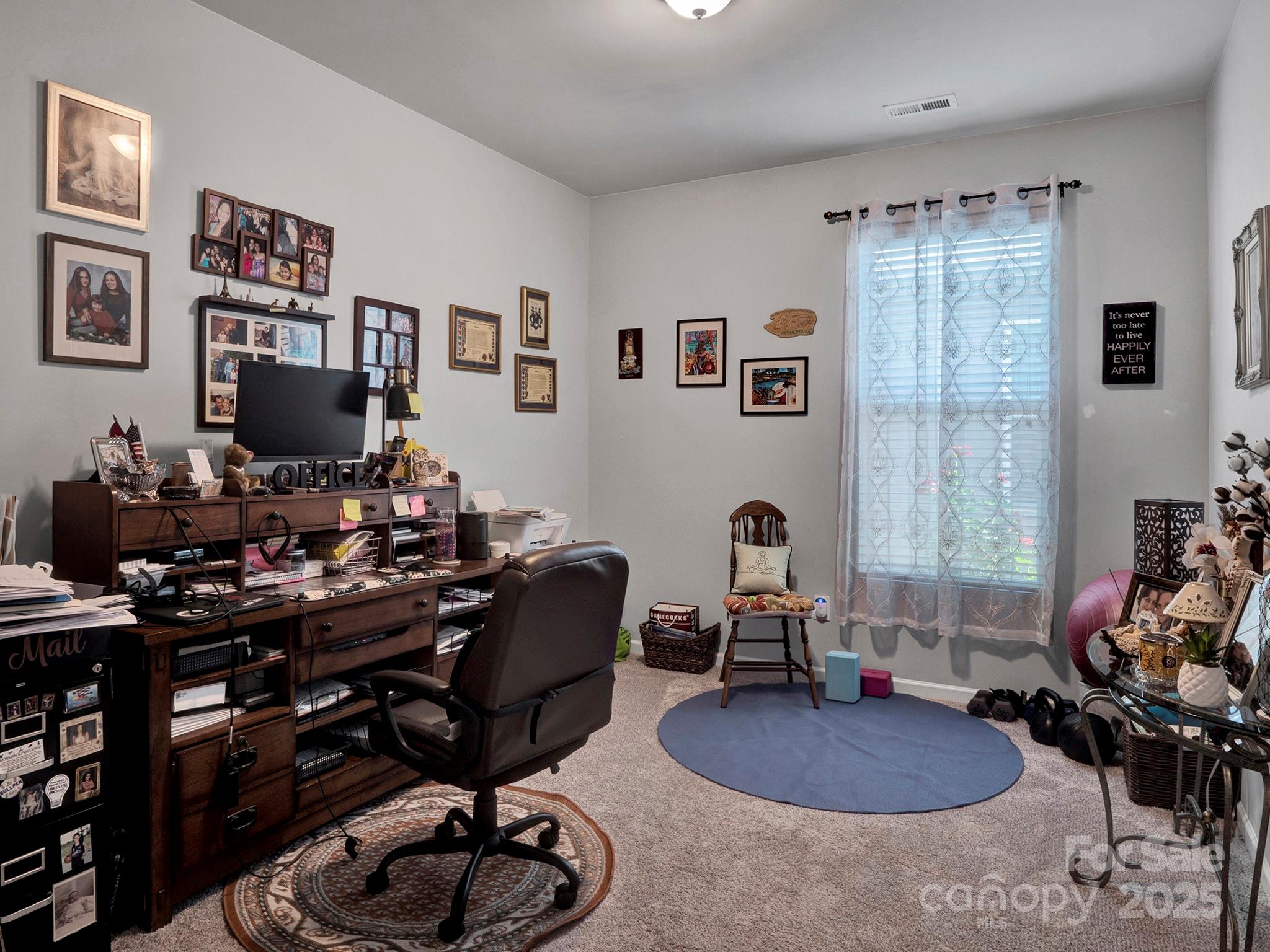 3129 Bridgewater Street, Unit 3E61 Lancaster, SC 29720 - Photo 29 of 48 a work room with furniture and wooden floor