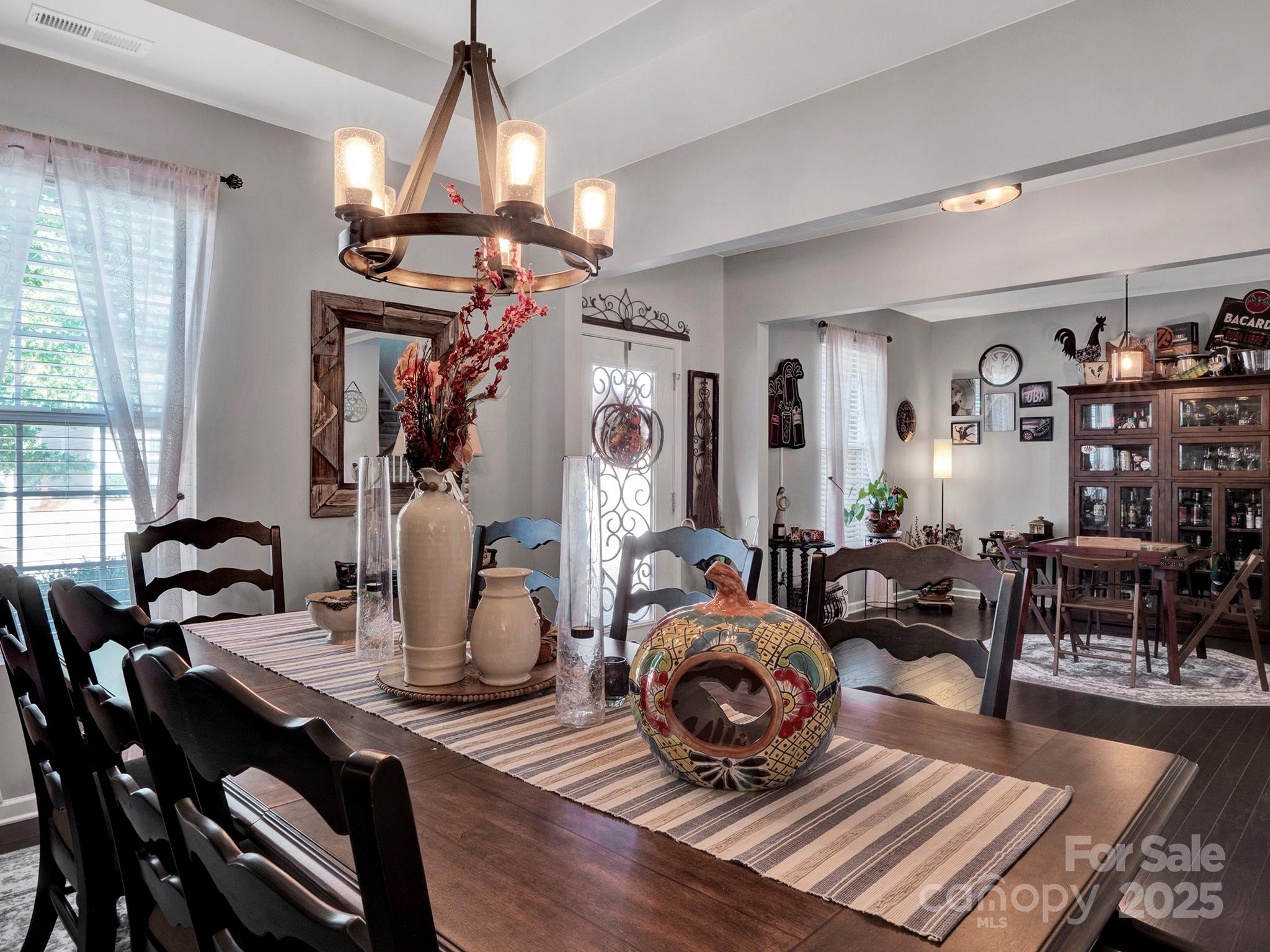 3129 Bridgewater Street, Unit 3E61 Lancaster, SC 29720 - Photo 3 of 48 a living room with lots of furniture and a chandelier